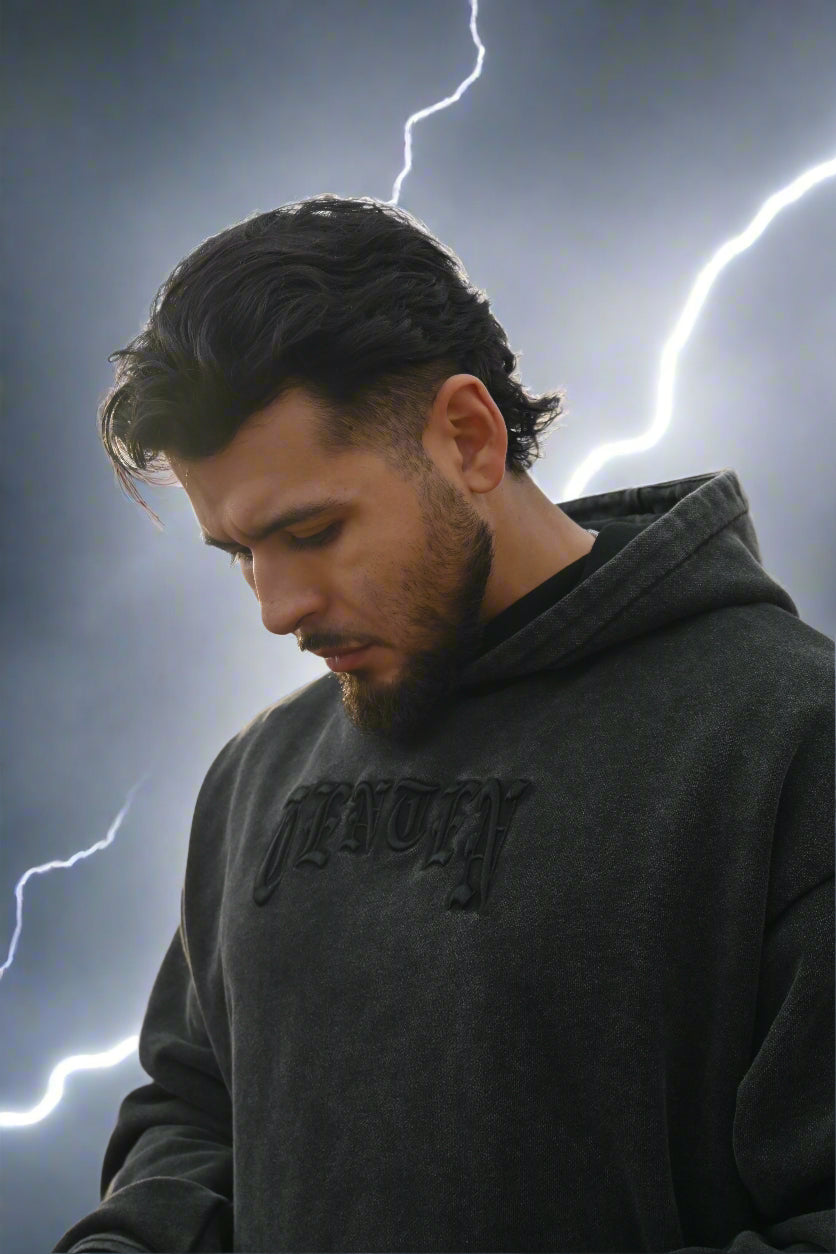 Embrace ultimate warmth and proven durability with our Black Acid Wash Hoodie featuring 3D puff embroidery, metallic pins, and an oblique 1010 design. 